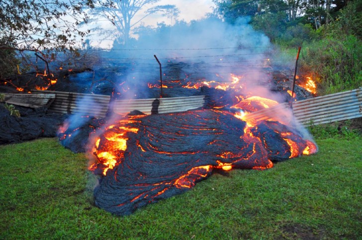 a-slow-moving-river-of-molten-lava-from-an-erupting-volcano-crept-over-residential-and-farm-property-on-hawaiis-big-island-at-the-end-of-october