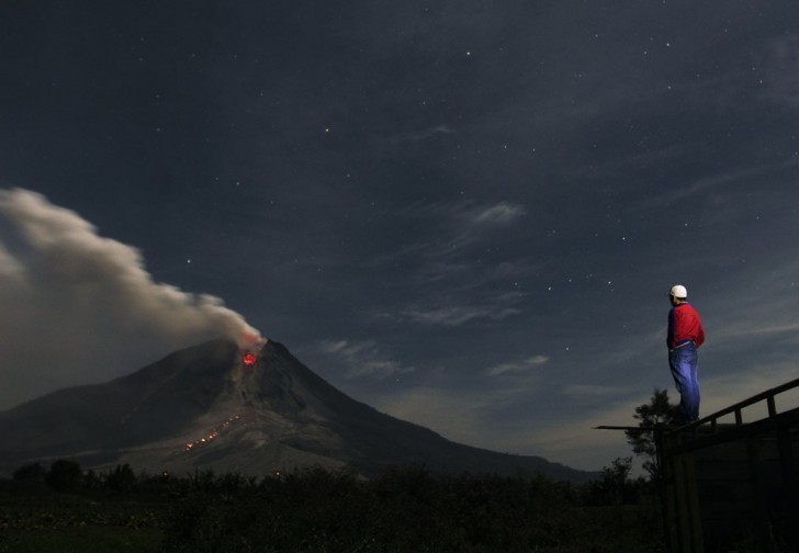 mount-sinabung-a-large-volcano-on-sumatra-island-in-indonesia-has-been-erupting-on-and-off-since-september-of-2013-covering-the-area-with-ash-and-forcing-thousands-of-people-to-flee-their-ho