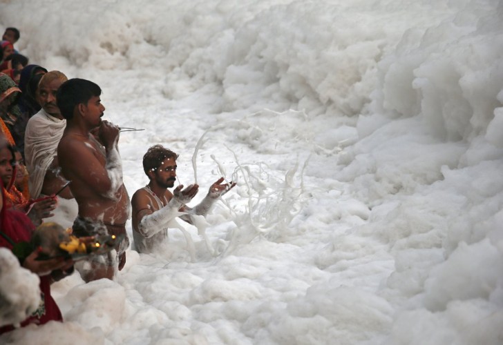 sewage-and-industrial-contaminants-create-the-foam-on-top-of-indias-yamuna-river-here-which-is-so-toxic-its-considered-dead-but-locals-still-bathe-in-the-waters-during-religious-festivals-li
