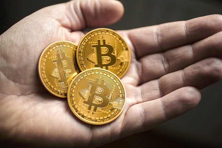 BERLIN, GERMANY - JANUARY 13:  In this photo illustration model Bitcoins lies in a hand on January 13, 2014 in Berlin, Germany. (Photo by Thomas Trutschel/Photothek via Getty Images)